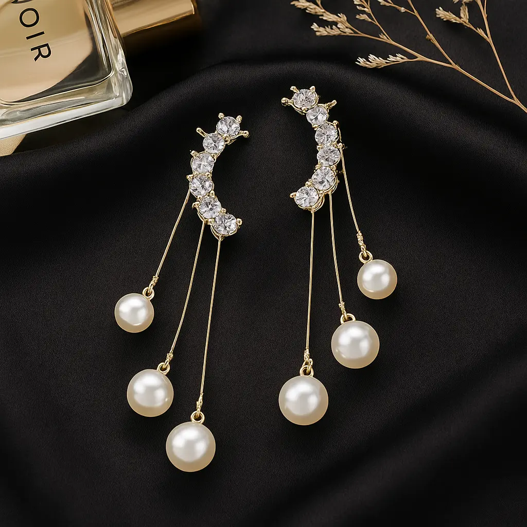 Gold Earrings with Pearls and Perfume.webp