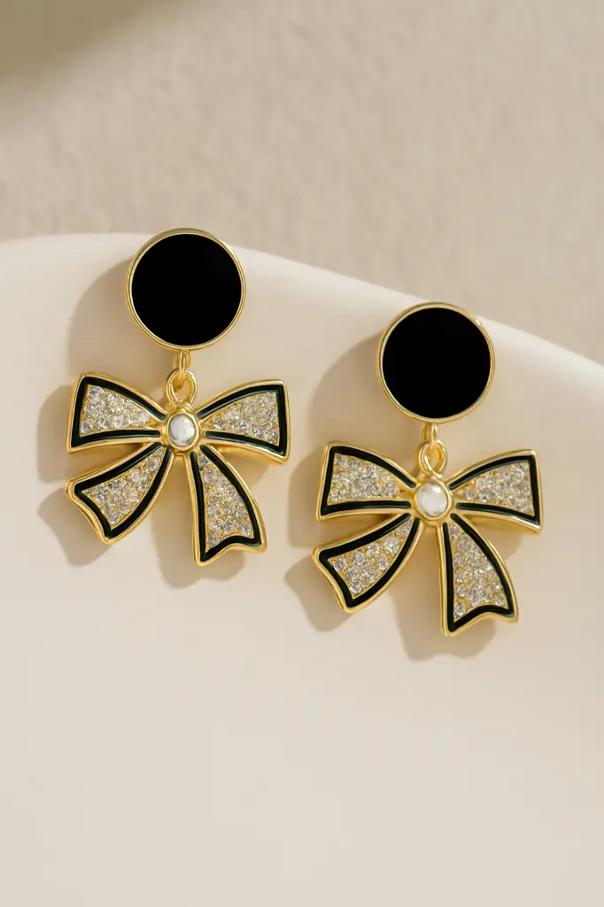 Crystal-Encrusted Gold Earrings on Ceramic Dish.webp