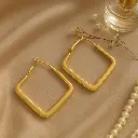 Elegant Gold Earrings with Pearls.webp