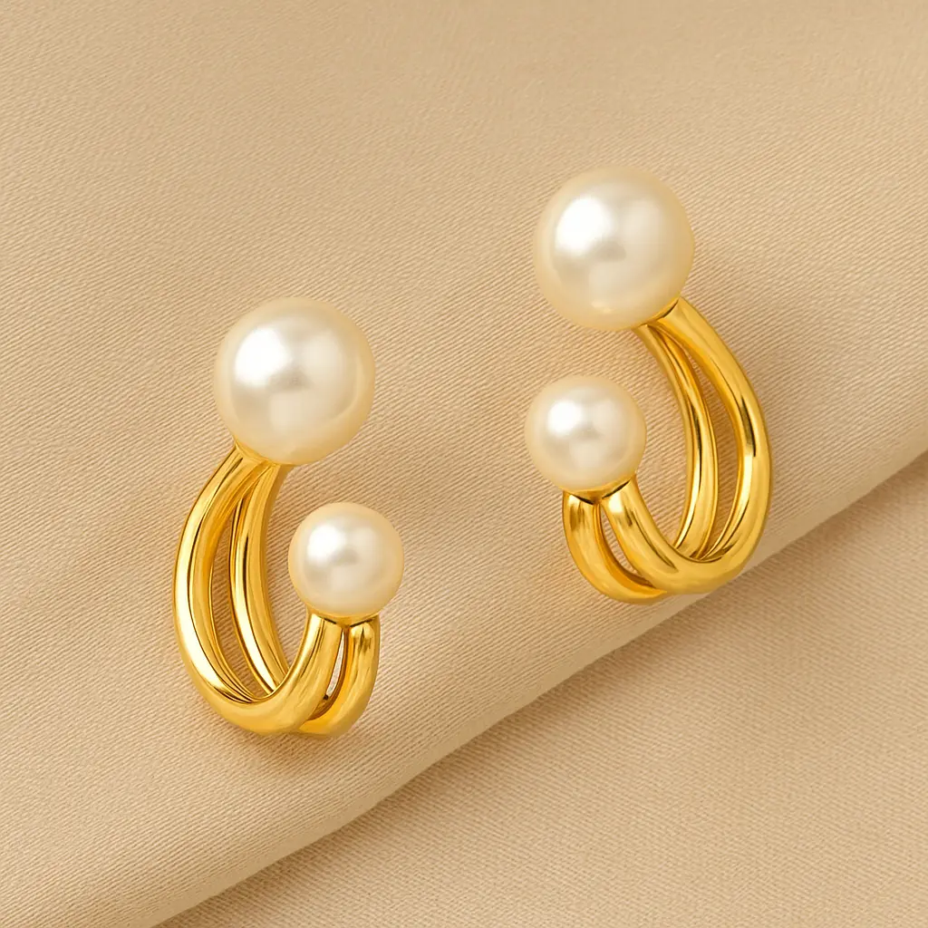 सुनहरे और मोती के झुमके.webp